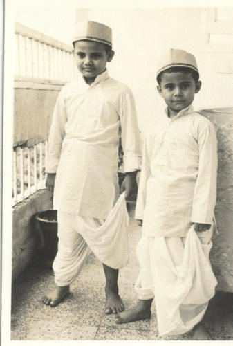 Dressed in the traditional attire of a cloth merchants. The family business was cloth hence the name Kapadia.Lt. Nawang is to the right in both the pictures