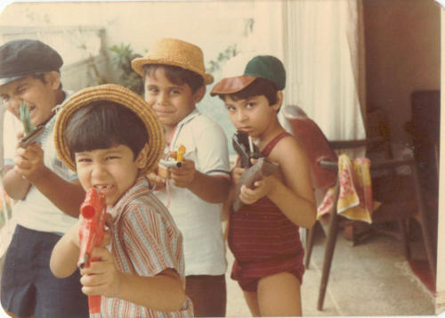 Holding guns from a young age...though they were only water guns then. Nawang is second from the right